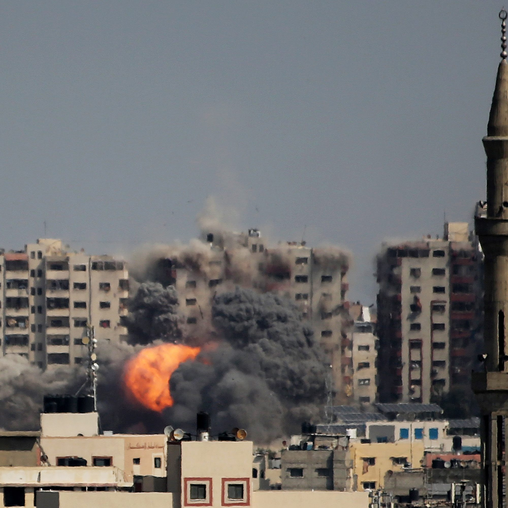 An explosion on a residential tower caused by Israeli raids in the northern Gaza Strip on October 12, 2023 in Gaza City, Gaza. Photo by Ahmad Hasaballah/Getty Images