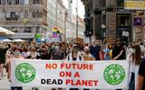 FILE PHOTO: People hold a banner during a protest march to call for action against climate change, as the spread of the coronavirus disease (COVID-19) continues, in Vienna, Austria, June 26, 2020. REUTERS/Leonhard Foeger/File Photo