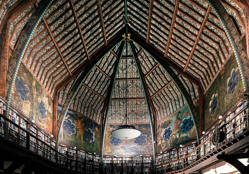 A photograph of a decorative mural across the ceiling of the Oxford Union library