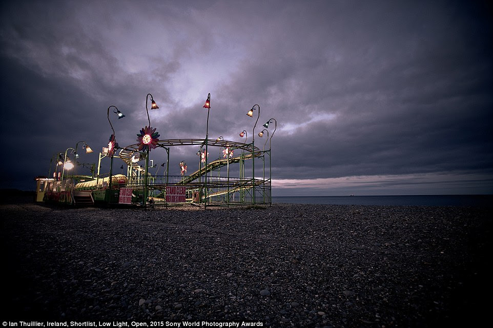 Isolated: A carnival ride stands alone and forlorn on a beach in Bray, Co. Wicklow, Ireland, in this entry by Irish photographer Ian Thuillier