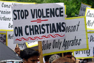 Several people are holding signs protesting violence against Christians.