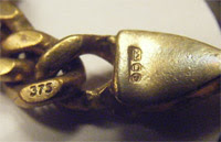 I believe this symbol to be the identifying mark of the maker. Fake Gold Hallmarks