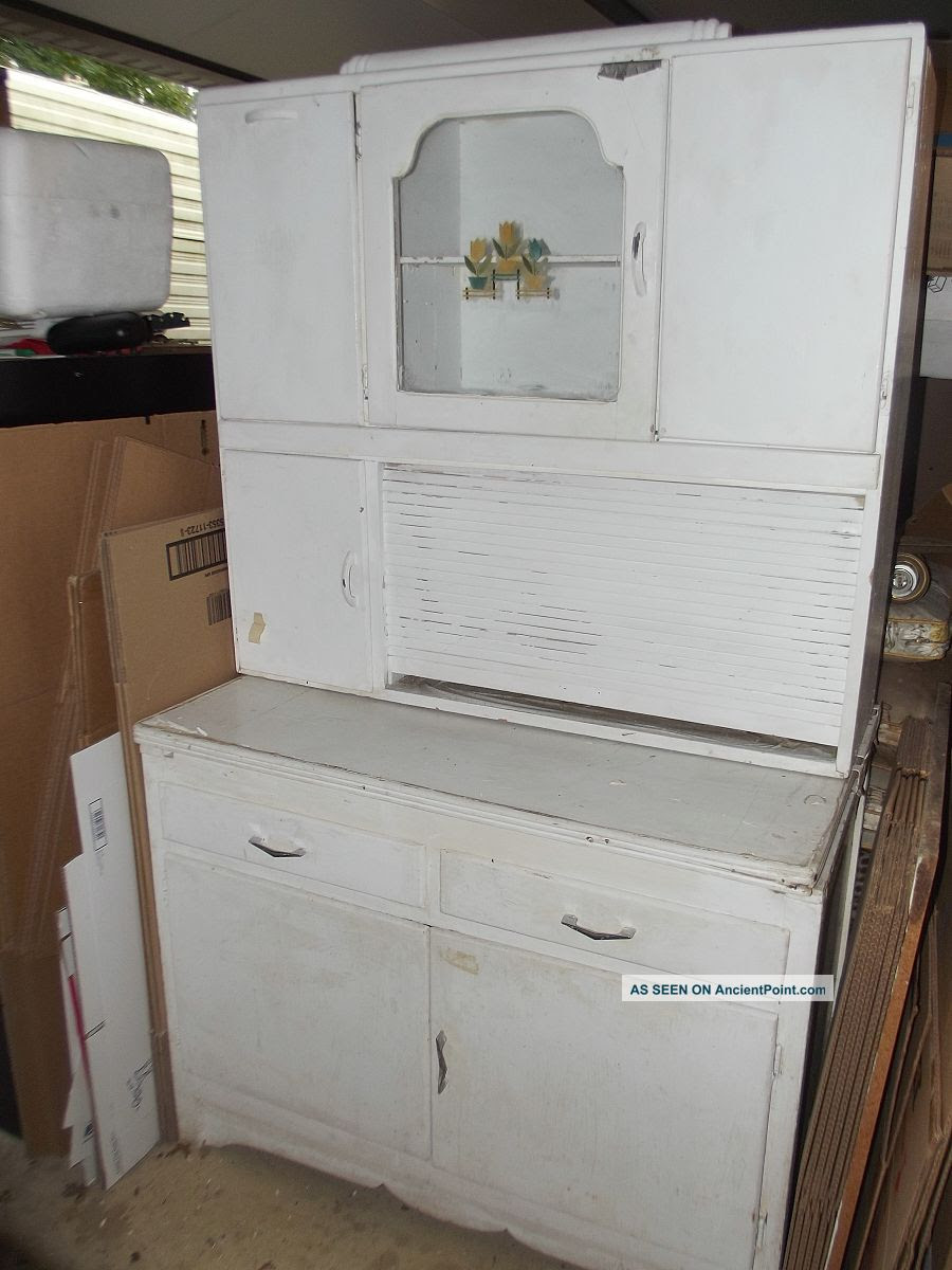 Pullout drawers or plastic bins can make deep cabinets more accessible, while modular drawer organizers can help keep utensils and smaller items. Vintage Marsh Hoosier Kitchen Cabinet With Flour Bin And Roll Top