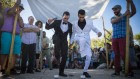 A gay couple has a symbolic wedding ceremony under a traditional wedding canopy during the annual Pride parade in Jerusalem, July 21, 2016. (Hadas Parush/Flash90)