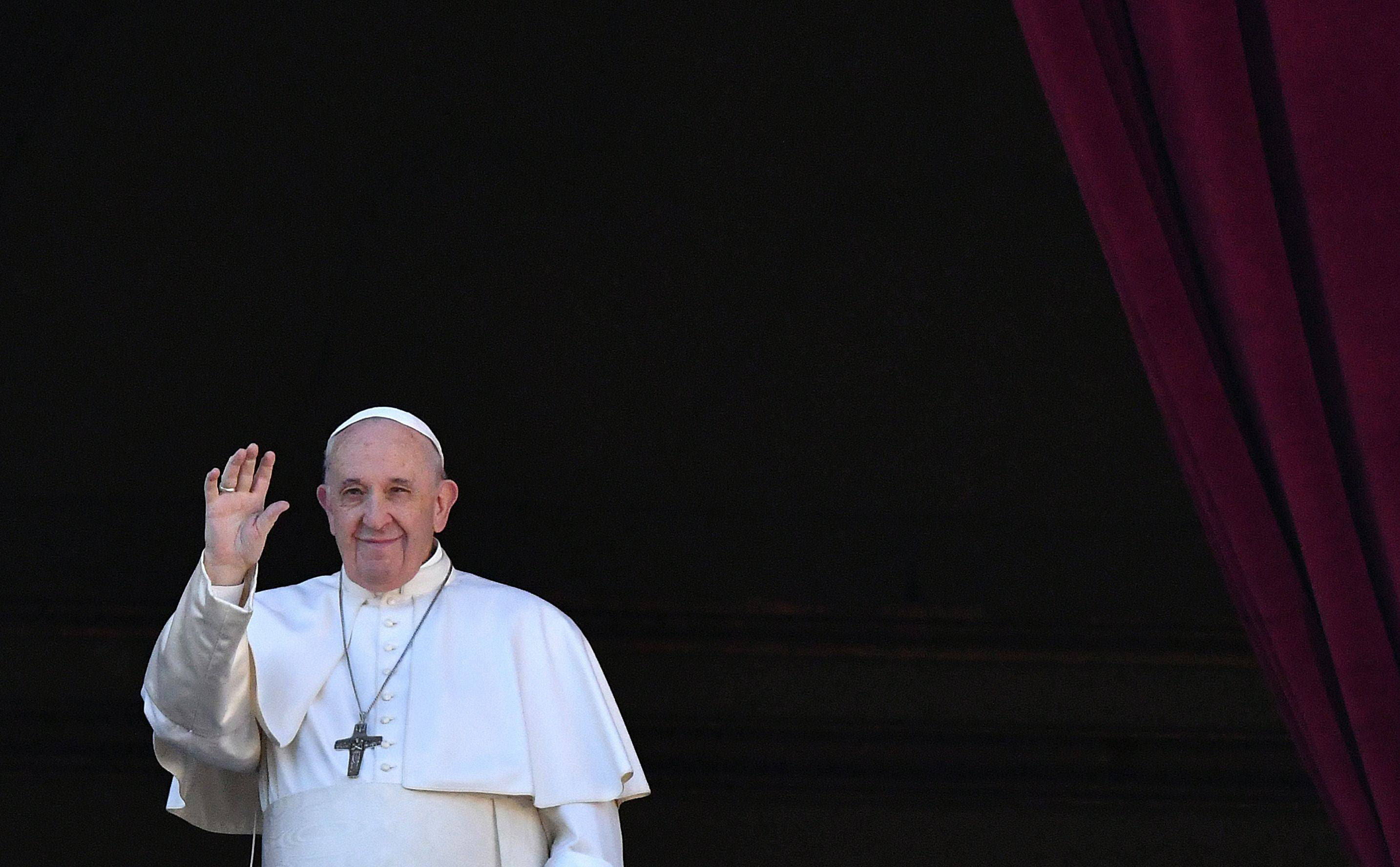 Pope Francis waves from the balcony of St. Peter's Basilica at the Vatican on Dec. 25, 2019. (Alberto Pizzoli/AFP/Getty Images)