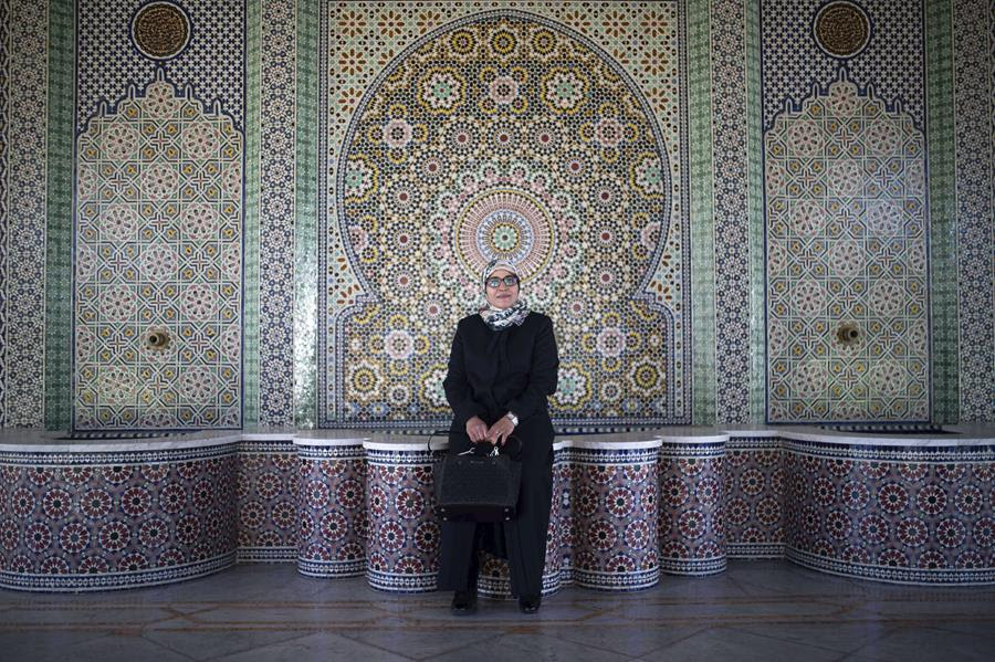 Aziza Moufid, 40, a female Muslim religious guide, or mourchida, poses for a portrait in Lalla Soukaina mosque, named after the daughter of the late King Hassan II, in Hay Riad neighborhood of Rabat, Morocco, Tuesday, Nov. 9, 2021. During the pandemic, Moufid has been using WhatsApp to explain sayings of the Prophet Muhammad to children, to help women learning to memorize and recite the Quran and to counsel teenage girls. (AP Photo/Mosa'ab Elshamy)