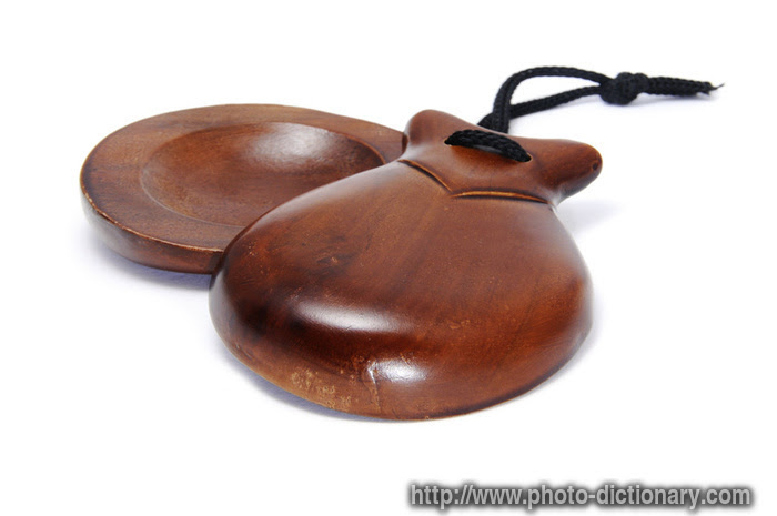 A musical instrument consisting of two small pieces of wood tied together by castanets are small wooden rattles, made in the shape of two bowls or cups, fitted together, and tied. Castanets Photo Picture Definition At Photo Dictionary Castanets Word And Phrase Defined By Its Image In Jpg Jpeg In English