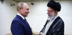 A handout photo provided by the Iranian Supreme Leader Ayatollah Ali Khamenei's office shows him (R) receiving Russian President Vladimir Putin in Tehran, on July 19, 2022. - Russian President Vladimir Putin arrived in Tehran for talks on the Syrian war at a three-way summit overshadowed by fallout from his country's war on Ukraine.