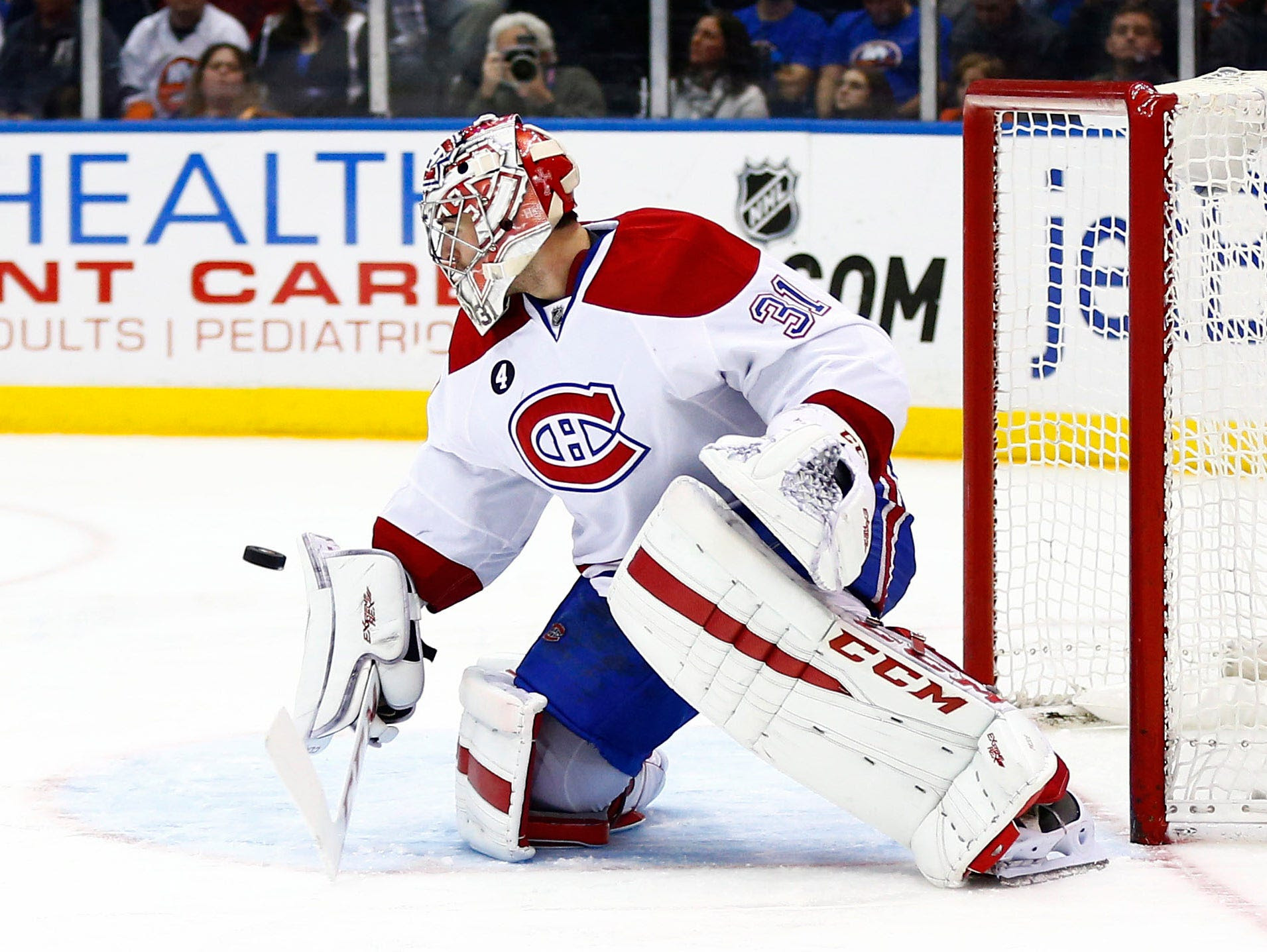 Montreal Canadiens goaltender Carey Price (31) makes a blocker save against New York Islanders during the second period at Nassau Veterans Memorial Coliseum.