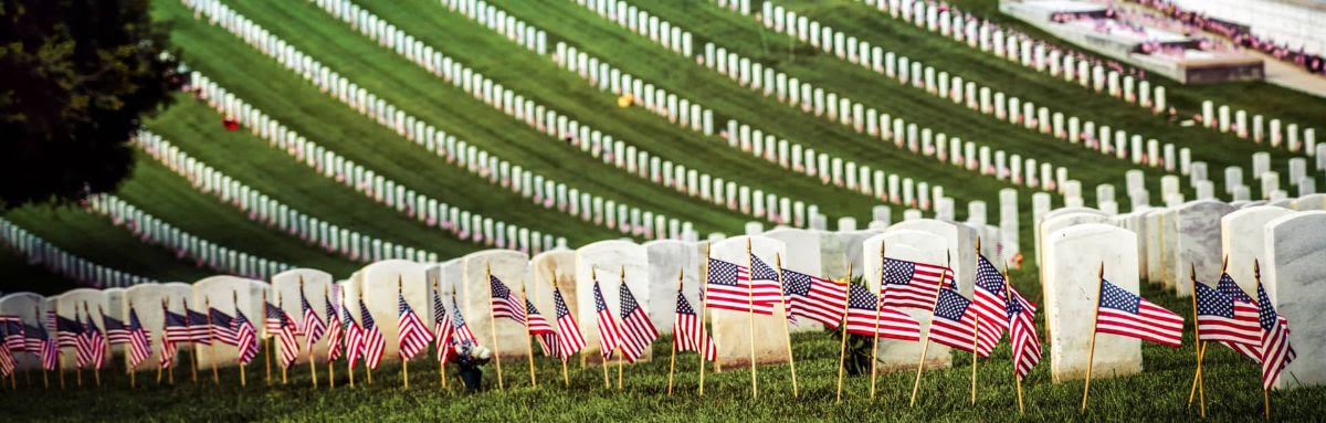 Photo of Arlington National Cemetary with flags.