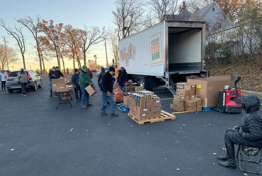 Volunteers unload a Northern Illinois Food Bank truck for distribution in a parking lot of St. Anne’s Episcopal Church in Woodstock, Illinois, Nov. 22, 2021. RNS photo by Bob Smietana