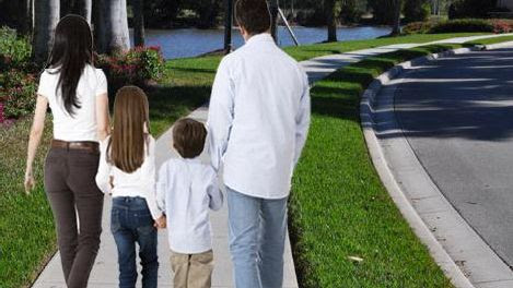 Graphic image of family walking on new sidewalk 