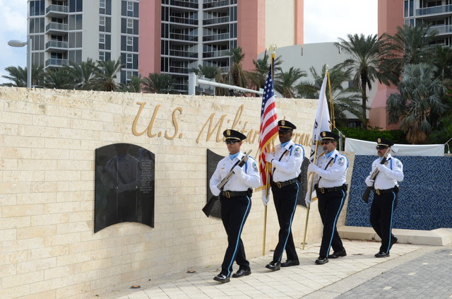 Sunny Isles Beach Color Guard marches in front of Veterans Wall at Heritage Park during Veterans Day Celebration.