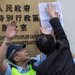 The police tried to stop protesters from taping their lists of demands to the entrance of the Communist Party headquarters in Hong Kong earlier this month.