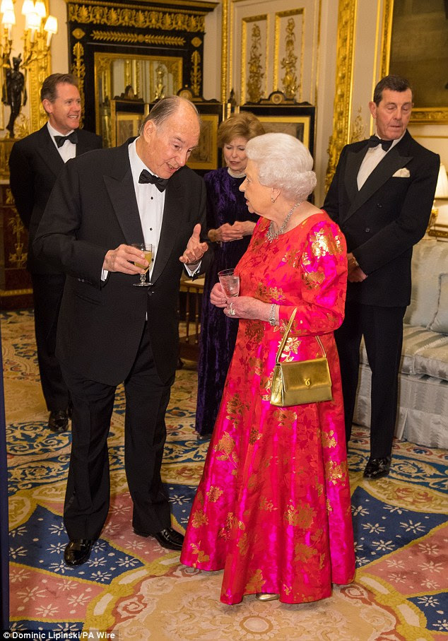 In a surprising fashion choice the Queen opted for a gold version of her beloved Launer bag 