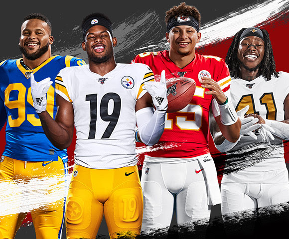 Four NFL players in their respective team jerseys stand side-by-side.