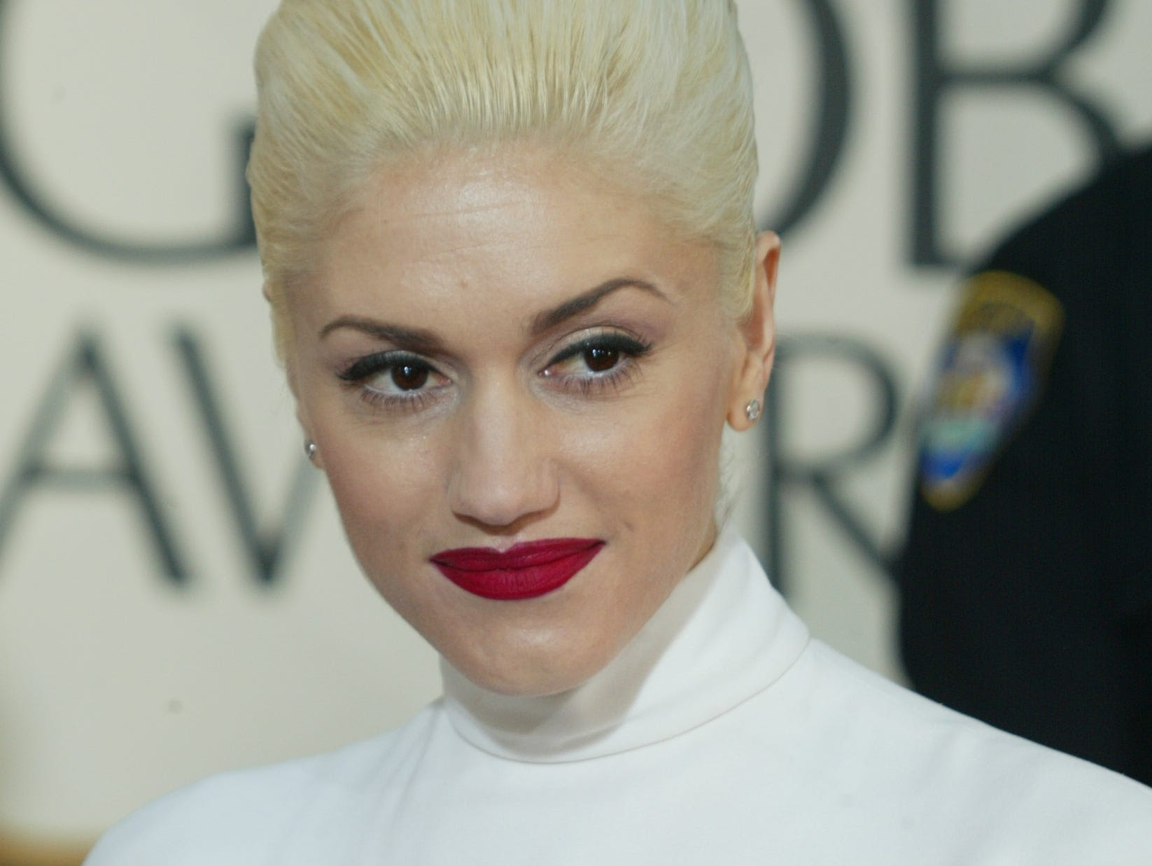 Gwen Stefani shows off her signature red lips and platinum blonde hair in 2004.