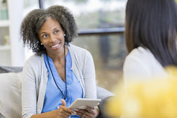 Counselor listening to patient