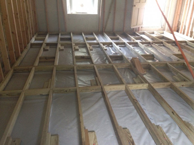 How to get Shed wood floor joists over concrete slab ...