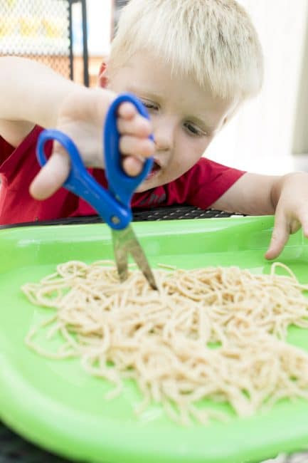 Cutting food is one of these great cutting activities for kids to learn scissors skills