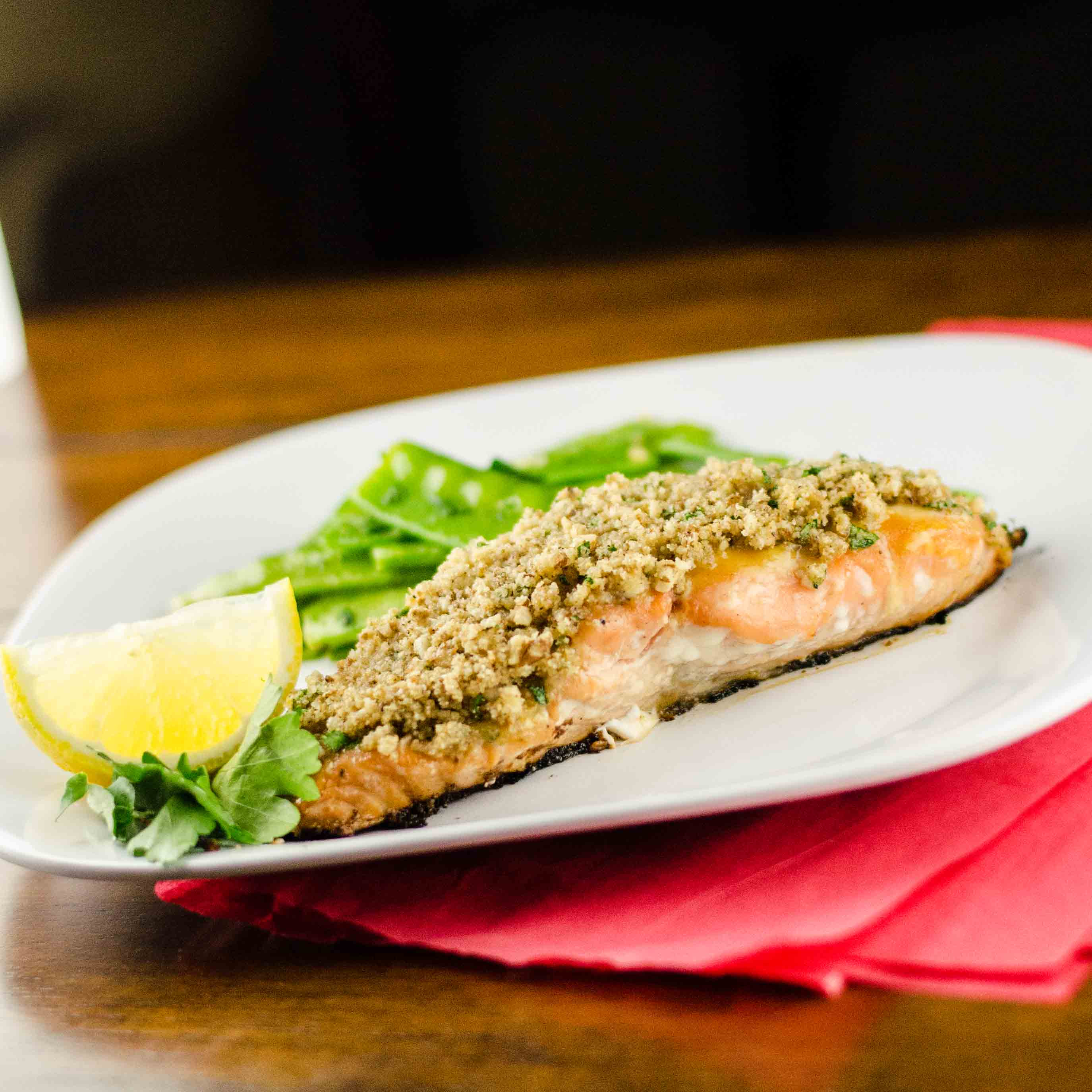 In a small bowl, mix together the mustard, butter and honey. Honey Mustard Pecan Crusted Salmon