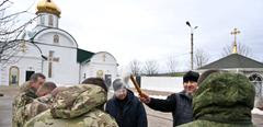 8601972 19.01.2024 A priest sprinkles holy water on Russian servicemen during Orthodox Epiphany celebrations, in Luhansk People's Republic, Russia. Evgeny Biyatov / Sputnik//SPUTNIK_18310067/Credit:Evgeny Biyatov/SPUTNIK/SIPA/2401191854