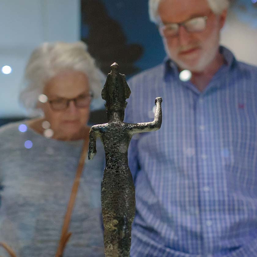 A couple viewing an object