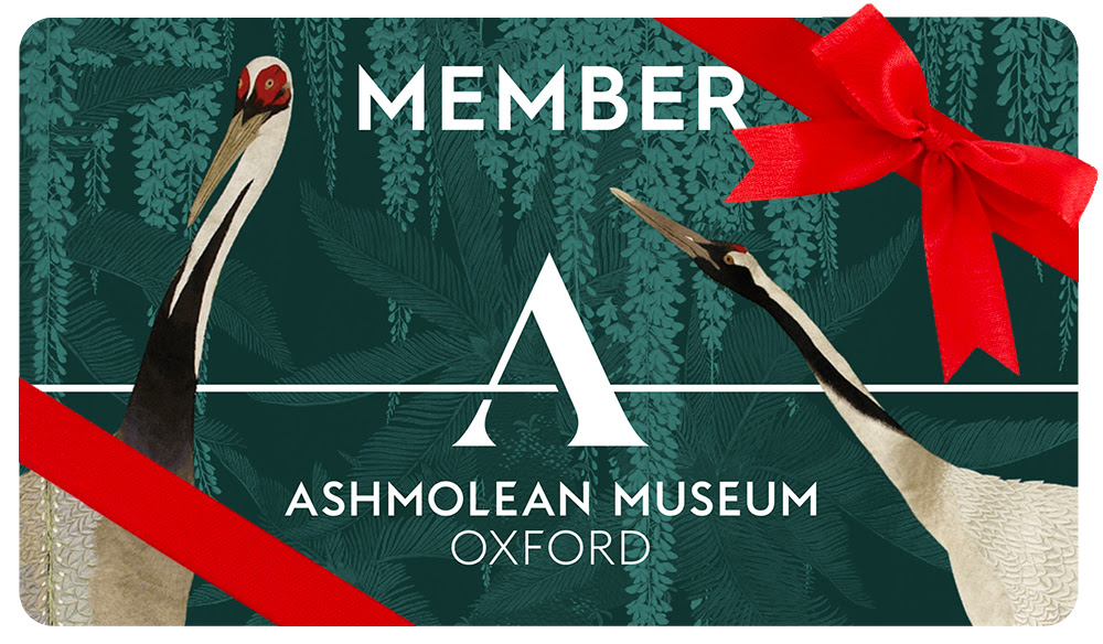 Green Ashmolean Membership Card with a red ribbon and bow around it