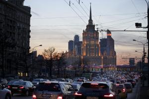 The Ukraina Hotel is silhouetted against the evening …