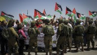 Israeli soldiers stop Palestinians during a demonstration at Hawara checkpoint, in the West Bank city of Nablus on May 11, 2017. (Nasser Ishtayeh/Flash90)