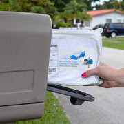 Person pulling mailbag from mailbox