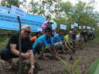 Sungai-Nibung-village-chief-Syarif-Ibrahim-second-from-left-leads-by-action-in-planting-mangrove-trees-in-Kubu-Raya-regency-West-Kalimantan-province.-1-140x105.jpg