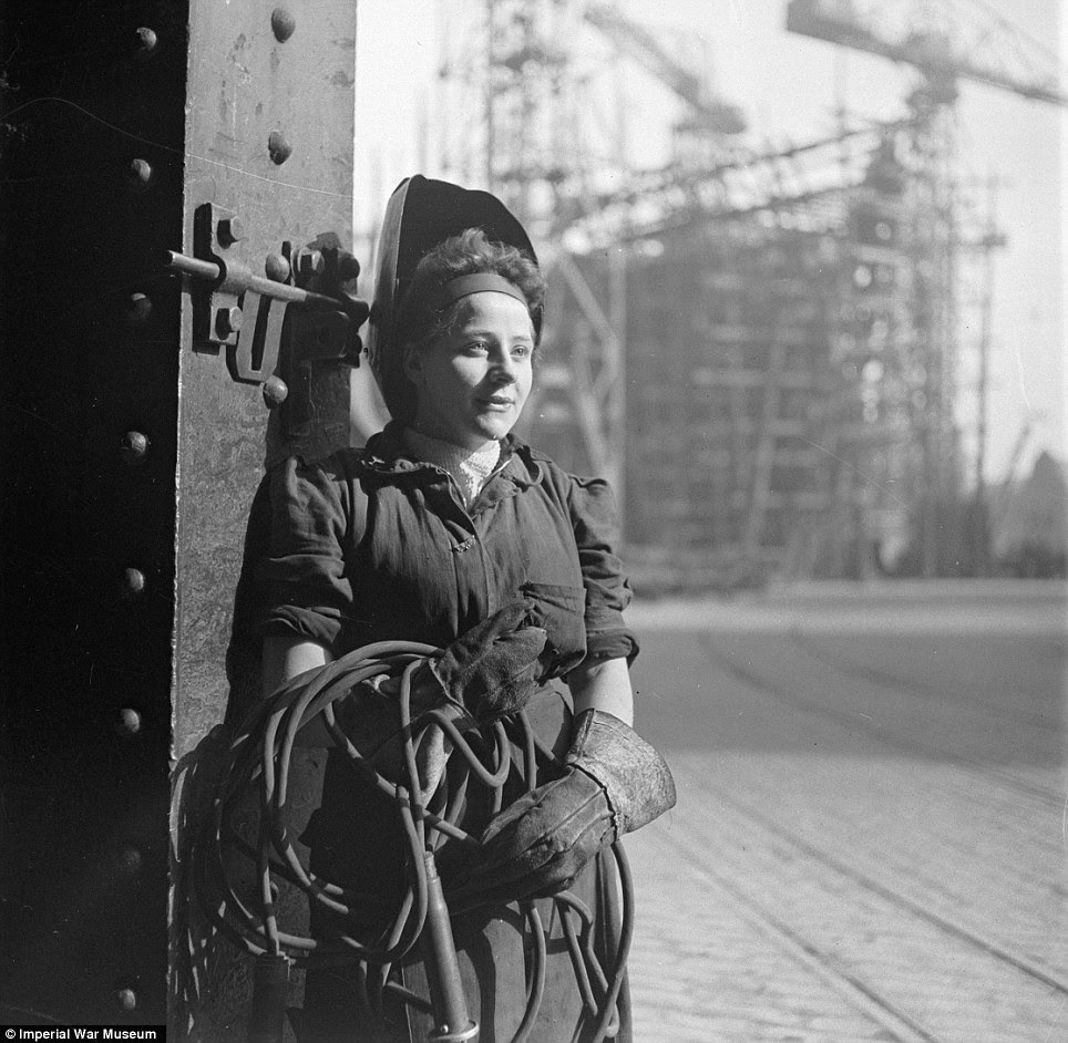 War effort: A female welder works on the deck of a new ship in Tyneside in 1943, in another expertly-composed Beaton photograph
