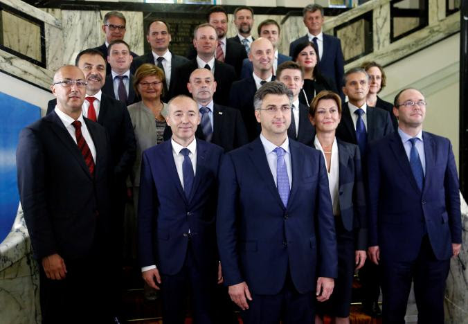 Croatia's new Prime Minister Andrej Plenkovic in centre poses with his ministers after his government was approved by the parliament in Zagreb October 19, 2016. Photo: REUTERS/Antonio Bronic