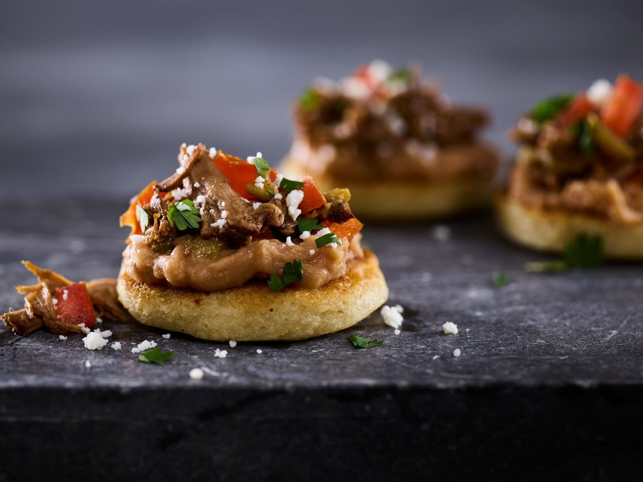 These are made with a homemade taco seasoning and served with the perfect toppings! Mexican Beef Sopes