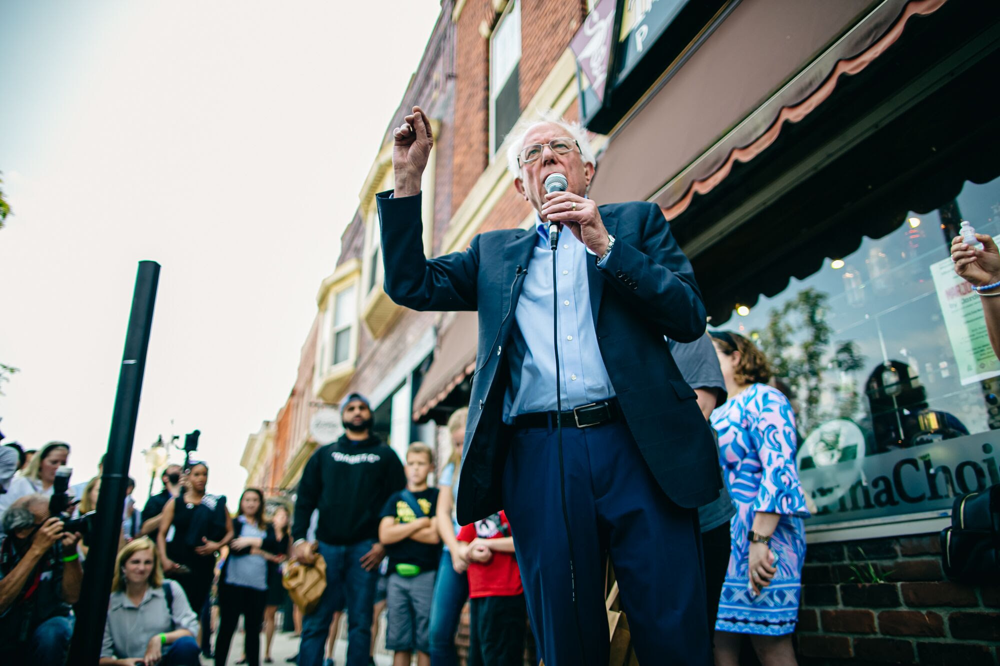 Bernie speaking outside of the pharmacy.