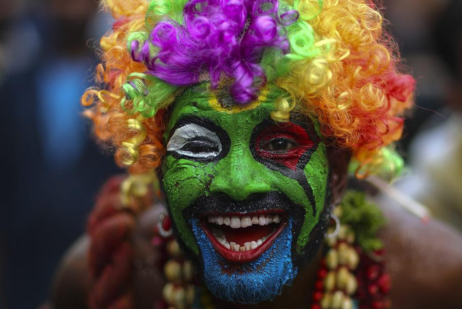 A devotee of Hindu goddess Kali smeared in color performs a ritual during the 'Bonalu' festival at the Golconda Fort in Hyderabad, India, Sunday, July 11, 2021. Bonalu is a month-long Hindu folk festival of the Telangana region dedicated to Kali, the Hindu goddess of destruction.