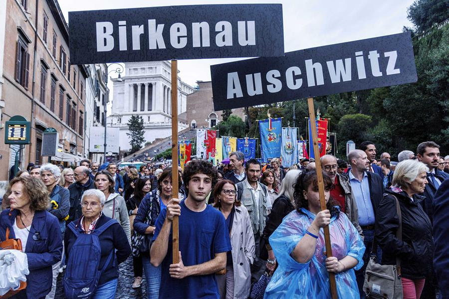 People participate in a march of remembrance marking the 80th anniversary of the roundup of the Jews of Rome in Rome, Italy, Monday Oct. 16, 2023. Italian lawmakers on Monday marked the 80th anniversary of the Nazi roundup of more than 1,200 Roman Jews in the Holocaust with a debate on a measure to partially fund a long-delayed Holocaust Museum in the capital.