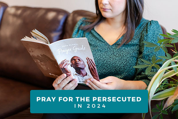 Woman reading VOM's 2024 Prayer Guide