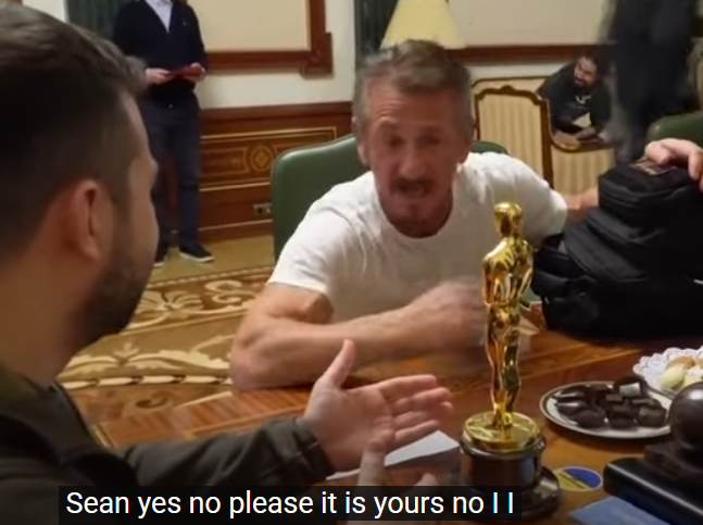 Photo of Sean Oenn iving his Oscar to Zalenskyy.