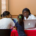 Linda Lott, left, and Myrlene Charles aided applicants at the Jessie Trice health center in Miami.