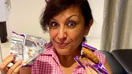 woman eating snacks in hospital bed