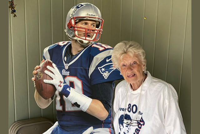 Betty Pensavalle poses with her Tom Brady cutout. Pensavalle was one of the inspirations for the movie "80 for Brady." Photo courtesy of the New England Conference.