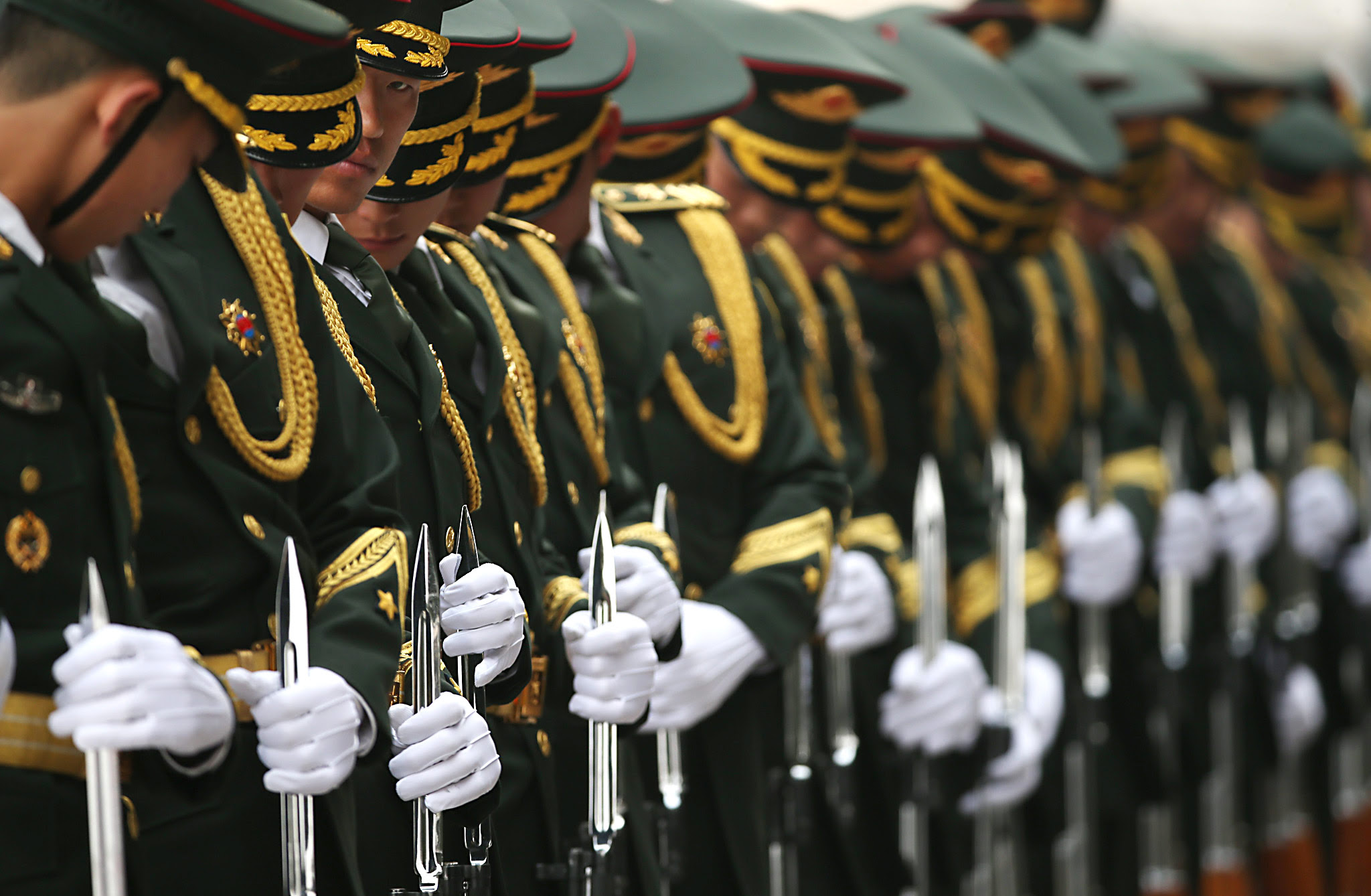 German President Joachim Gauck visits China...epa05223963 Chinese honour guards adjust their attire before a welcome ceremony for German President Joachim Gauck at the Great Hall of the People in Beijing, China, 21 March 2016. The German President is on a five-day state visit to China.  EPA/HOW HWEE YOUNG