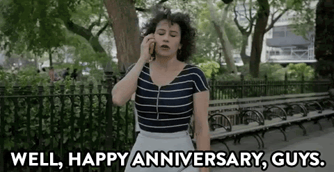 Animation of girl on phone saying Happy Anniversary.