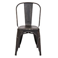 Set of four distressed industrial metal dining chairs in bronzed black