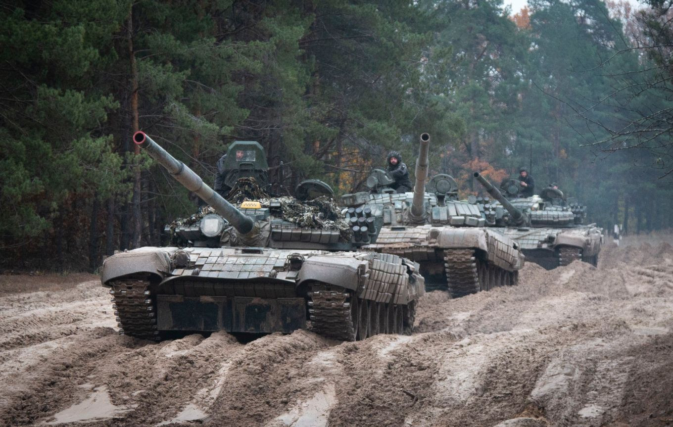 Ukrainian soldiers on captured Russian tanks last fall. (Aleksandr Shulman/AP)