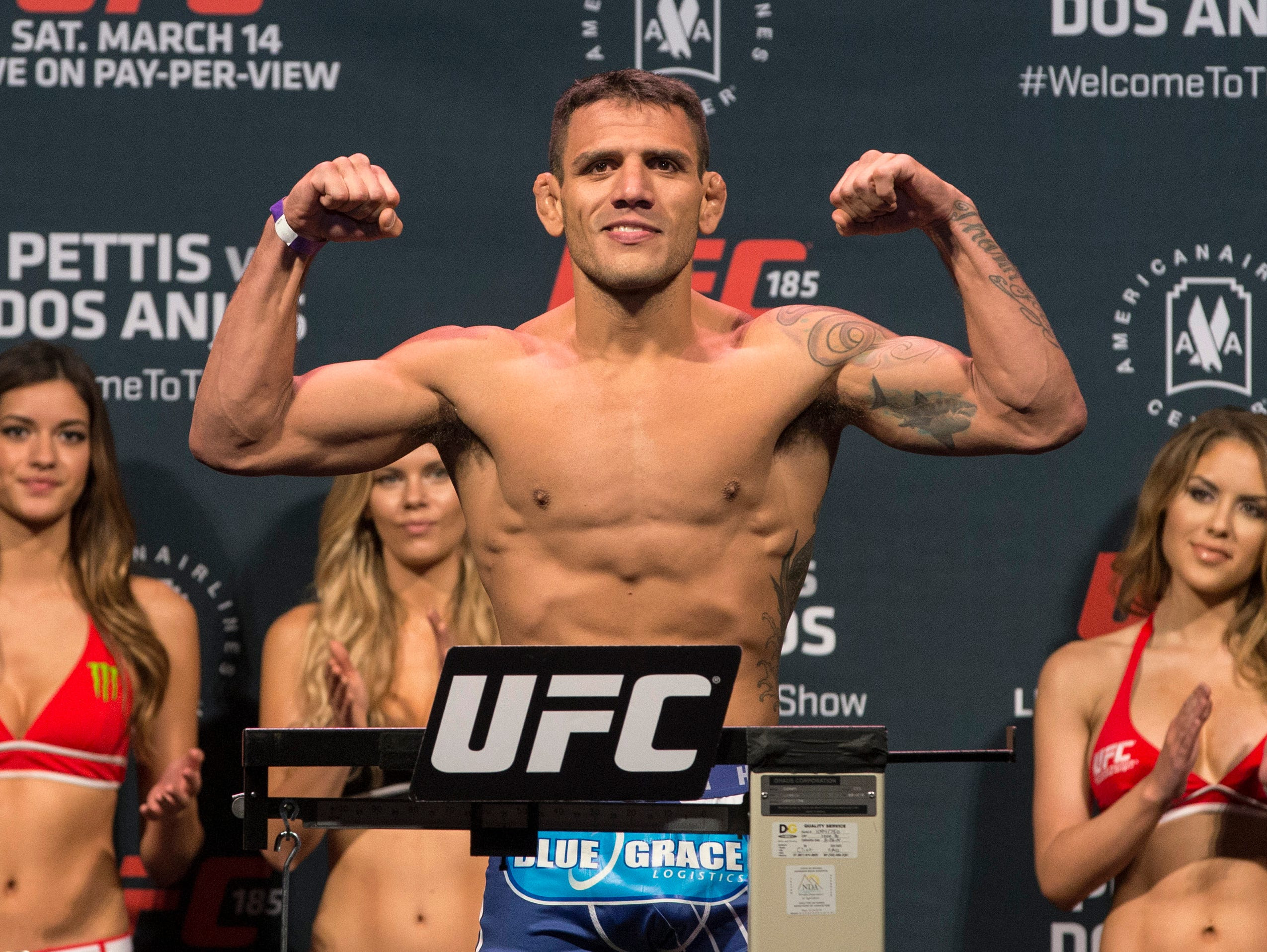 Rafael dos Anjos stands on the scale during weigh-ins for UFC 185 at Kay Bailey Hutchison Convention Center.