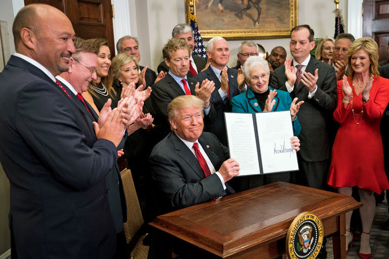 President Trump signed an executive order on health care in the Roosevelt Room of the White House on Thursday.
