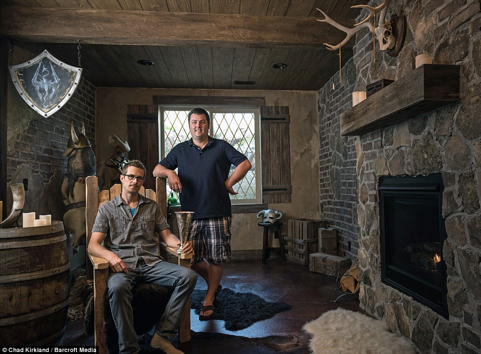 Hanging out: Mr Kirkham says that one of the biggest fans of the basement is his brother Tristan (right) who often comes round to play video games on the room's $20,000 cinema system